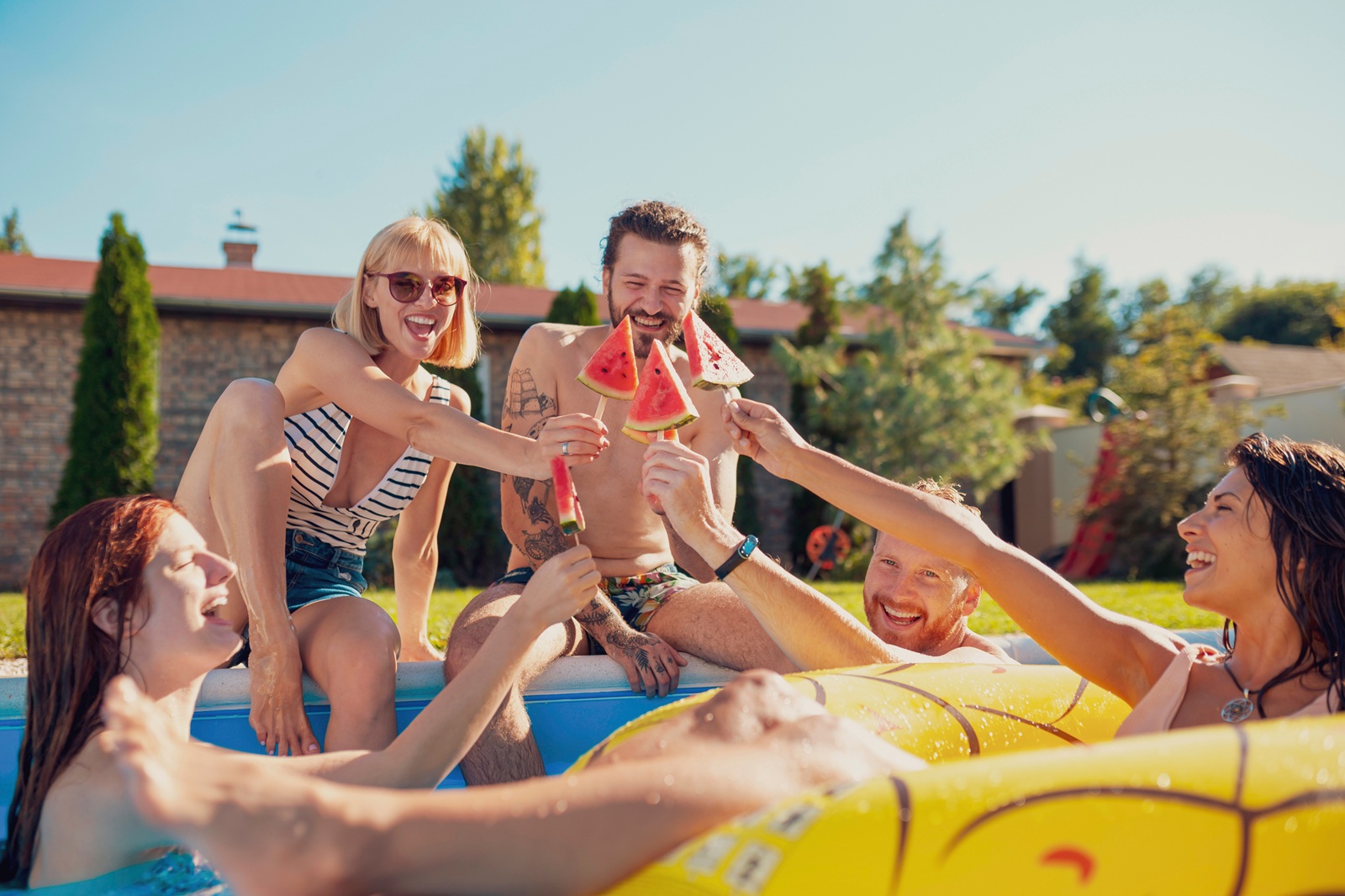 With friends enjoying drinks outdoors in sunny weather